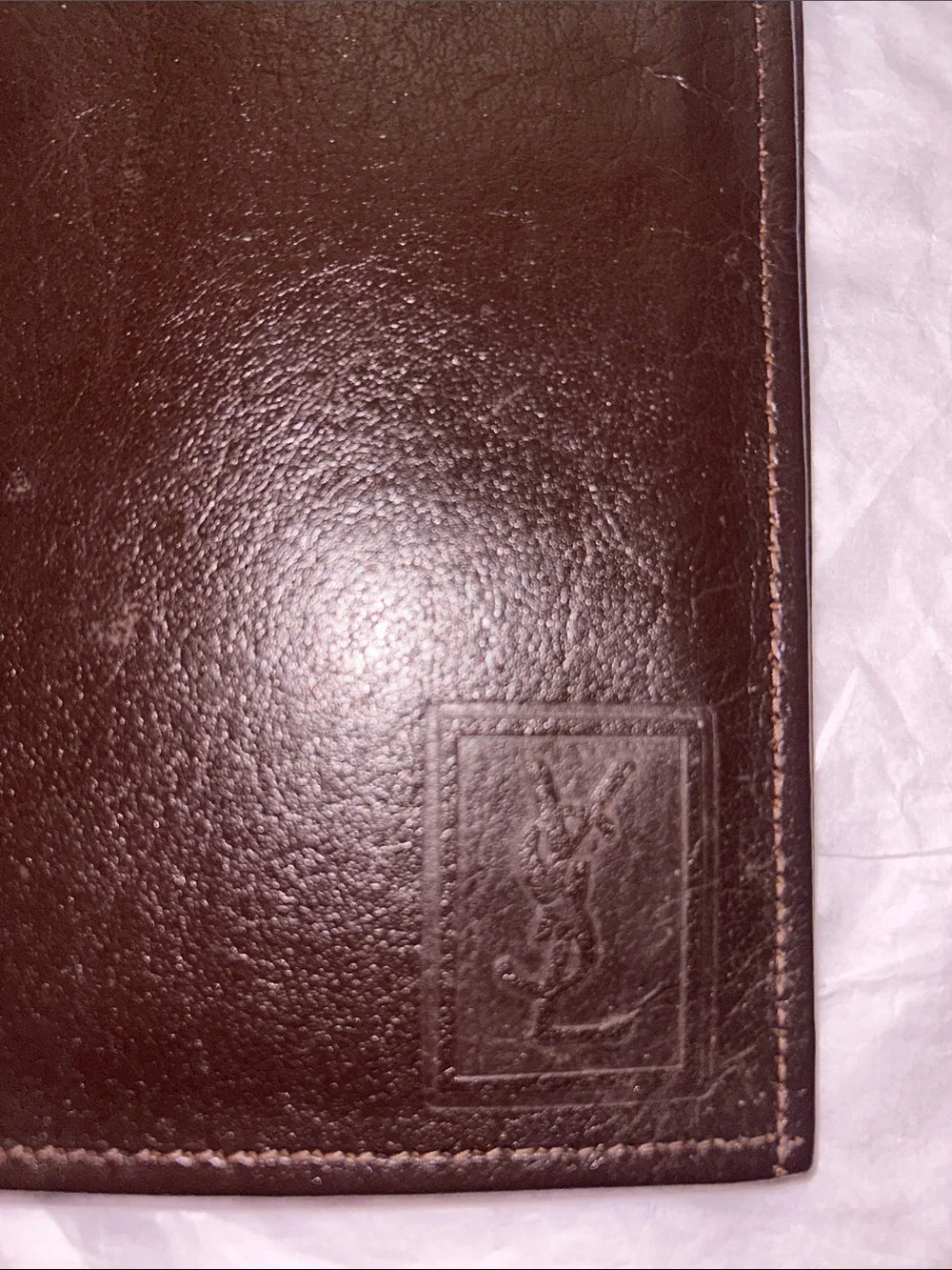 Yves Saint Laurent (YSL) vintage brown leather bifold wallet featuring an emboss